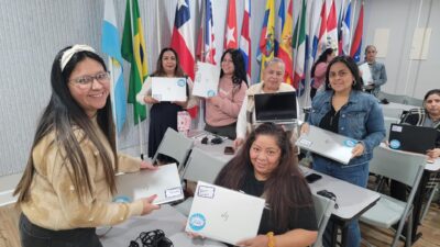 Computer Class participants receiving their certificates and computer upon completion of course.