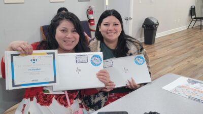 Computer Class participants receiving their certificates and computer upon completion of course.