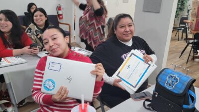 Computer Class participants receiving their certificates and computer upon completion of course.